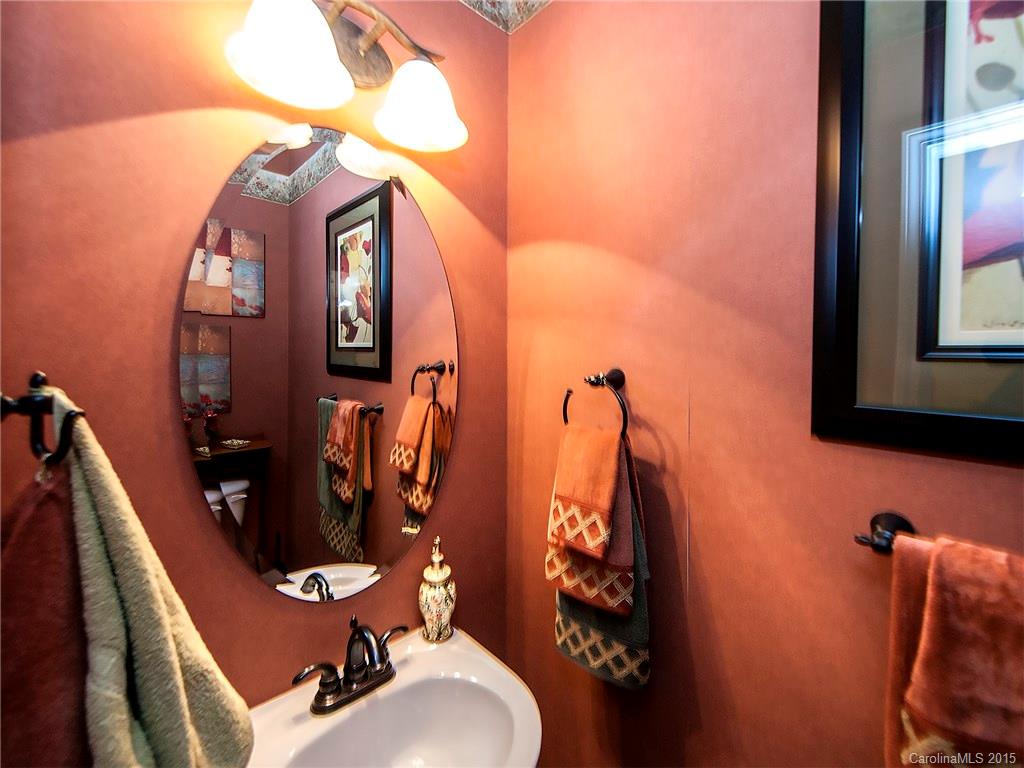 1907 Travertine Lane, Unit 209 Fort Mill, SC 29708 - Photo 8 of 18 a bathroom with sink mirror and vanity