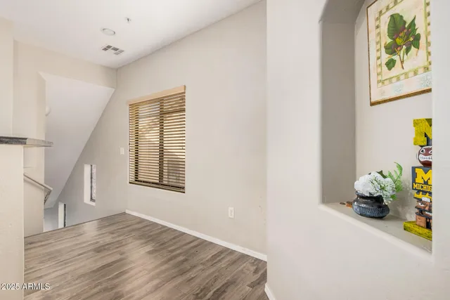 a view of an entryway with wooden floor