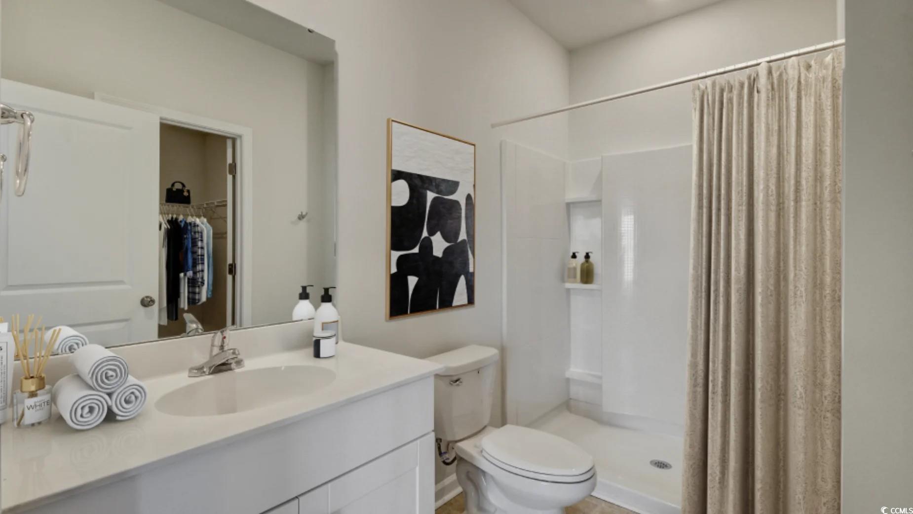 216 Warner Xing Way Loris, SC 29569 - Photo 11 of 12 Washroom featuring washing machine and dryer, base