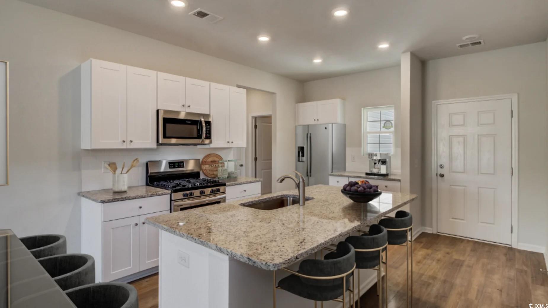 216 Warner Xing Way Loris, SC 29569 - Photo 5 of 12 Living area with light wood-style floors, plenty o