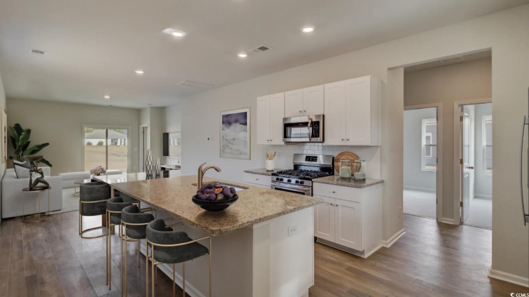 216 Warner Xing Way Loris, SC 29569 - Photo 6 of 12 Kitchen with a kitchen breakfast bar, visible vent