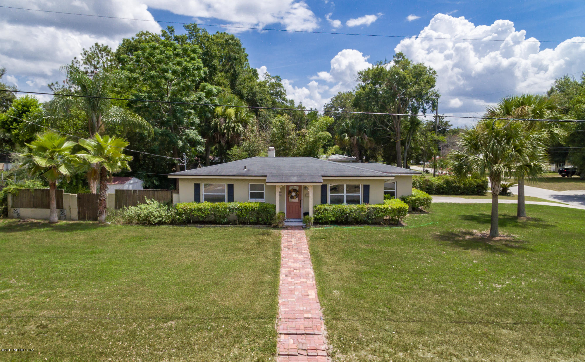 2606 Clemson Road Jacksonville, FL 32217 - Photo 1 of 25 a front view of a house with a yard