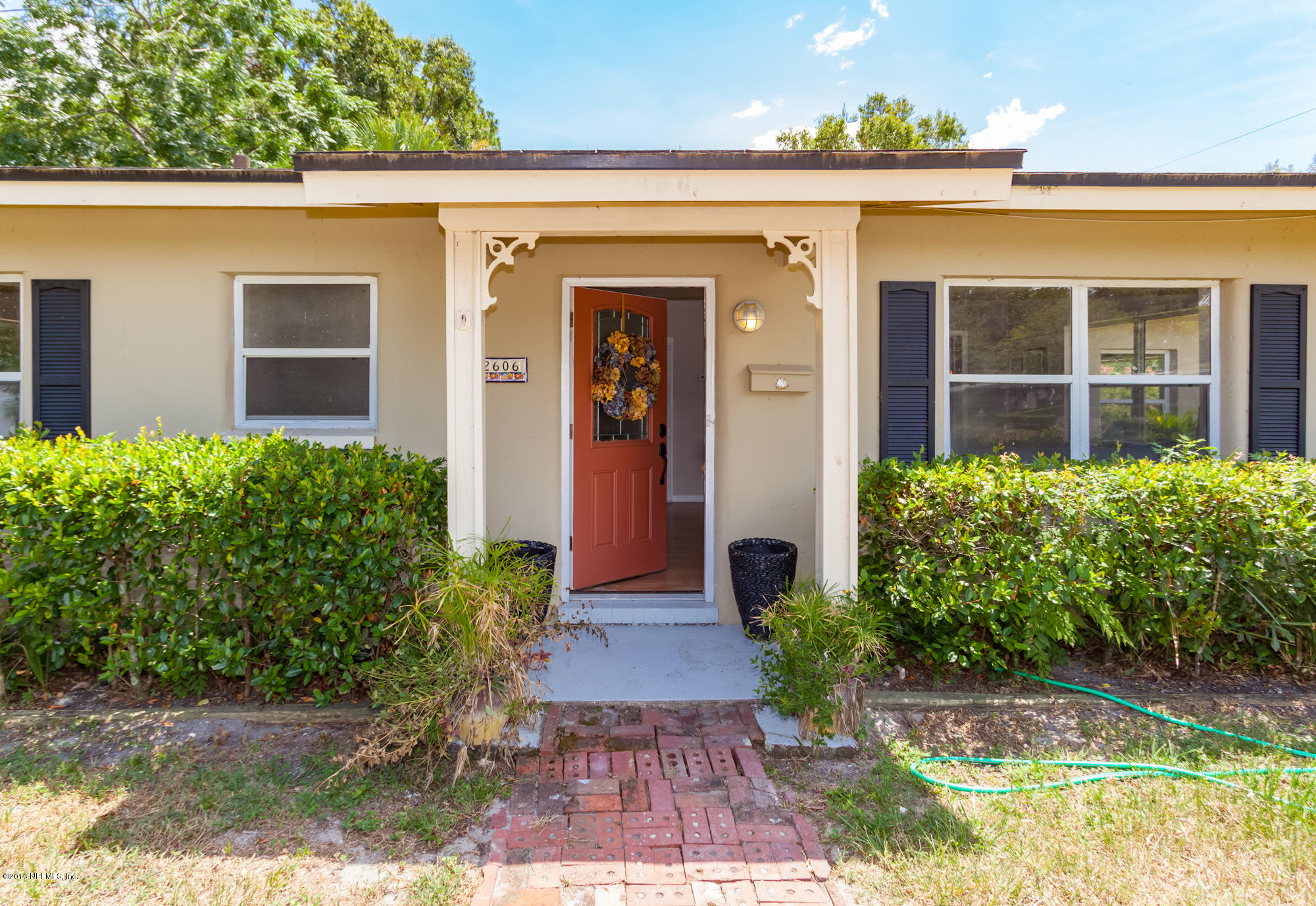 2606 Clemson Road Jacksonville, FL 32217 - Photo 2 of 25 front view of a house with potted plants