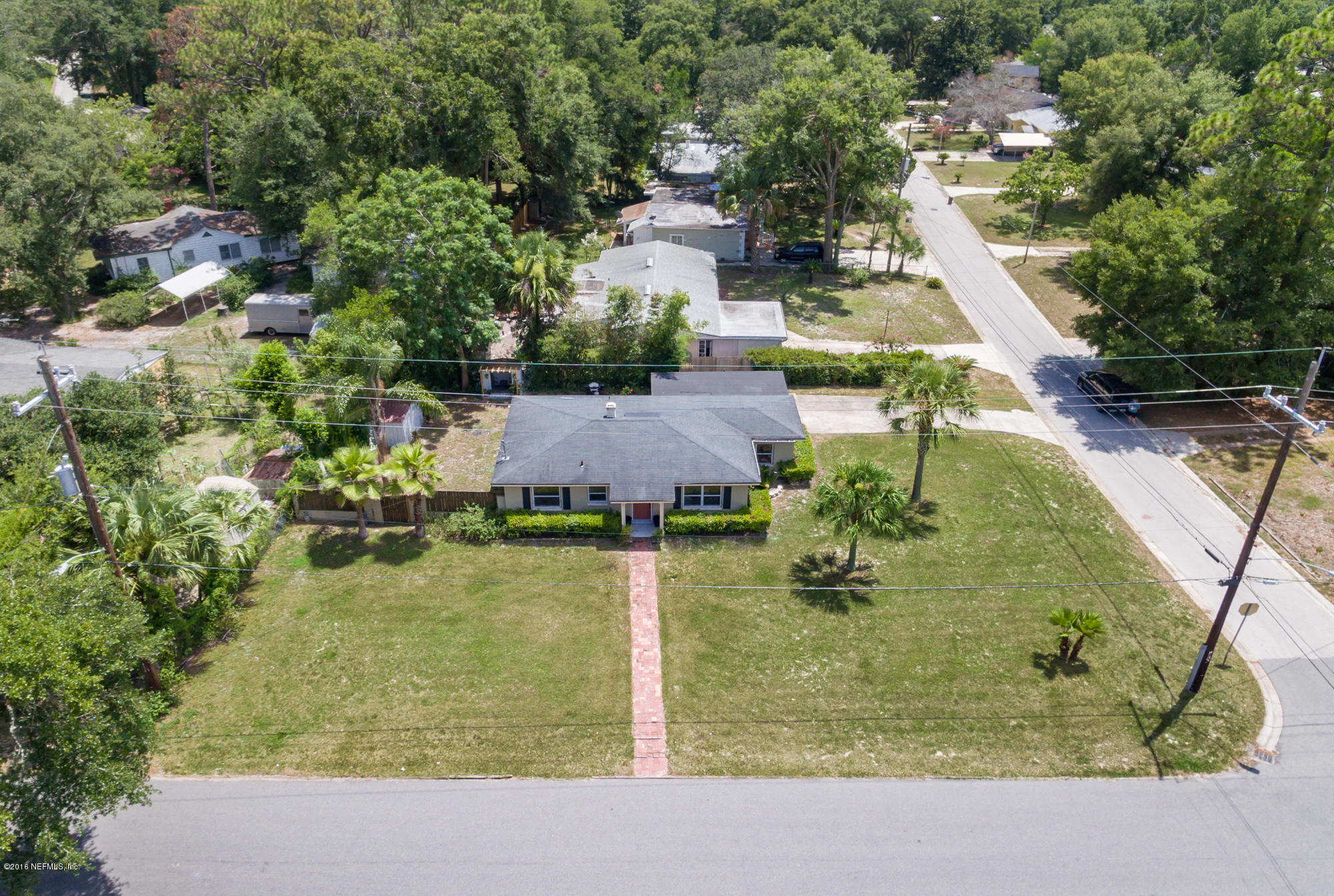 2606 Clemson Road Jacksonville, FL 32217 - Photo 23 of 25 a swimming pool view with a garden