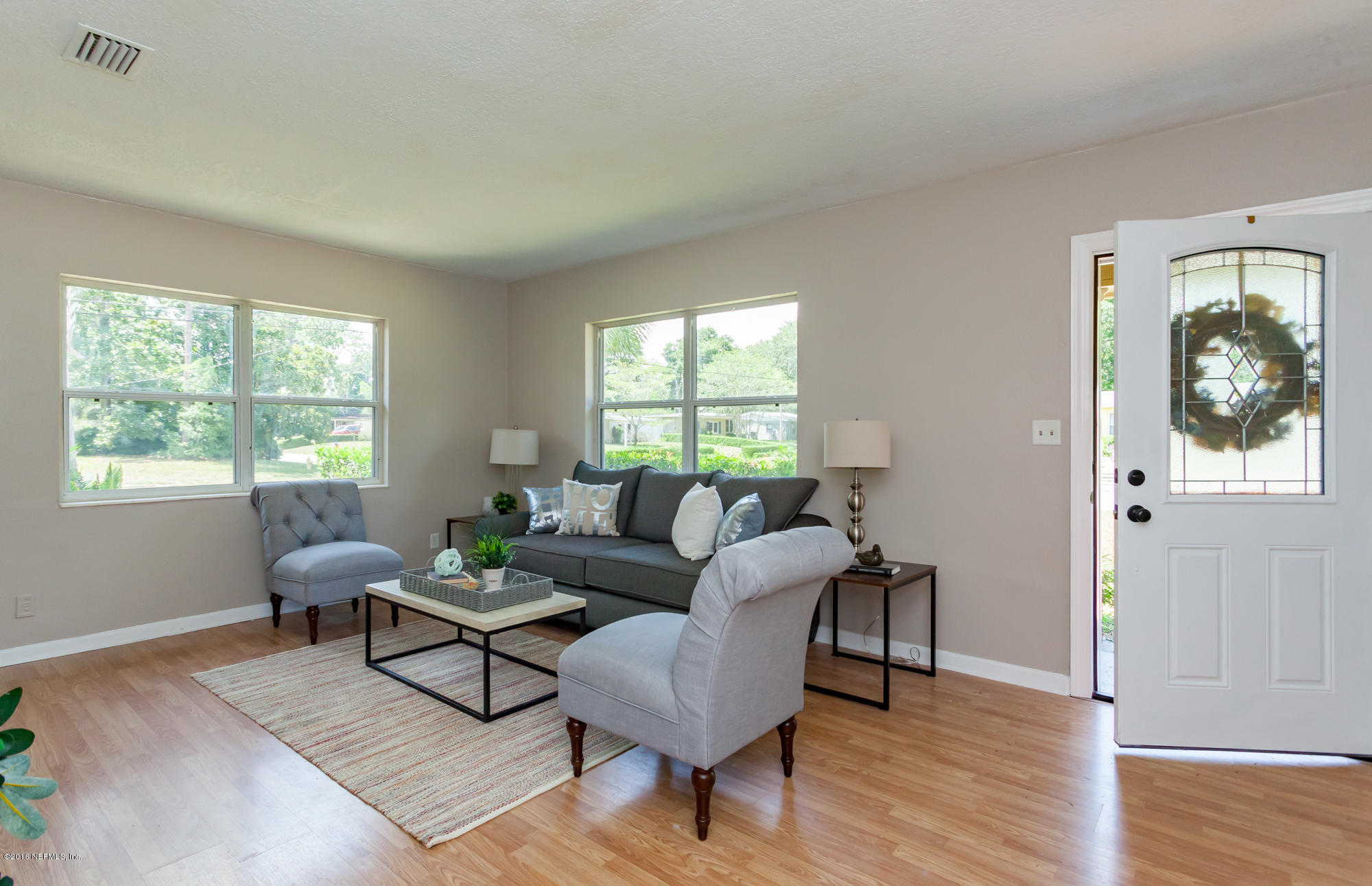 2606 Clemson Road Jacksonville, FL 32217 - Photo 3 of 25 a living room with furniture and a window