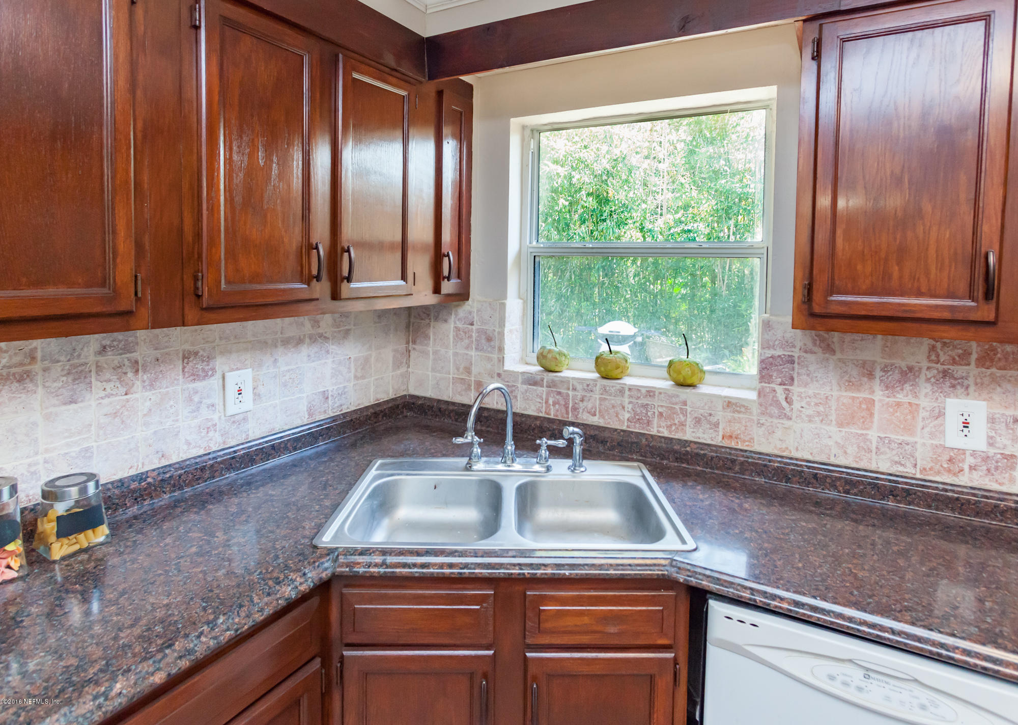 2606 Clemson Road Jacksonville, FL 32217 - Photo 9 of 25 a kitchen with a sink cabinets and window