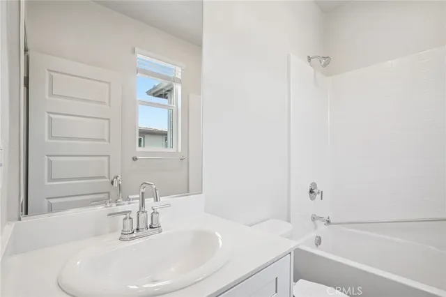 a bathroom with a sink and a bathtub