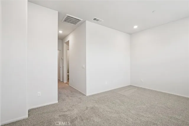 a bathroom with double sink and a mirror