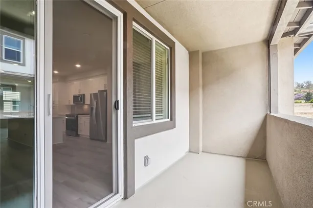 a view of building with car parked