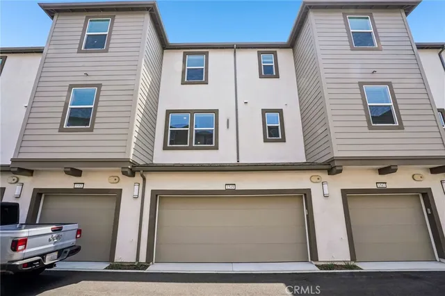 a red car parked in front of a building