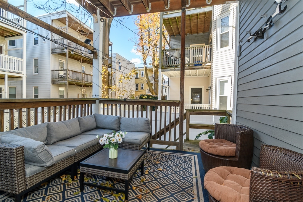 775 Columbia Road, Unit 1 Boston, MA 02125 - Photo 11 of 11 a balcony with table and chairs