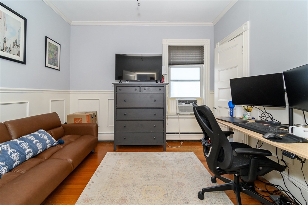 775 Columbia Road, Unit 1 Boston, MA 02125 - Photo 4 of 11 a livingroom with workspace and a couch