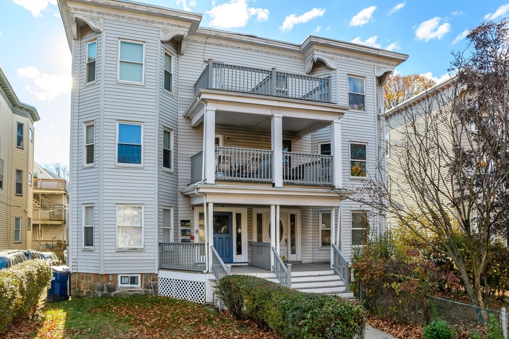 775 Columbia Road, Unit 1 Boston, MA 02125 - Photo 9 of 11 a front view of a house with a yard