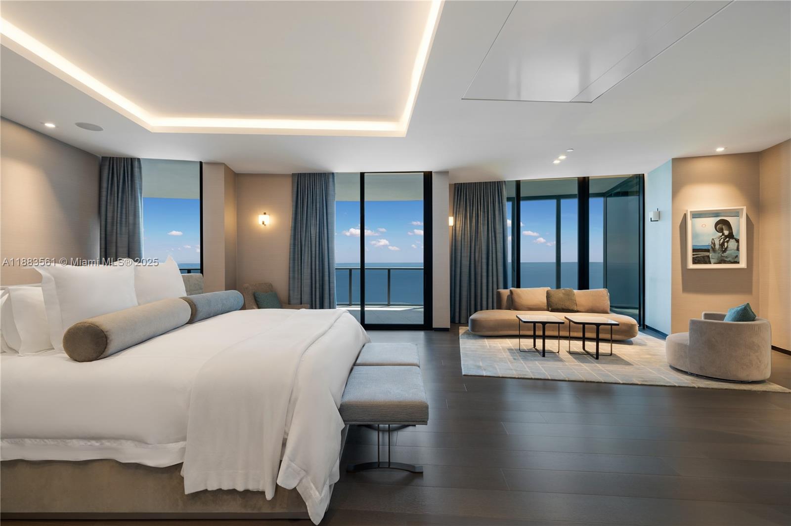 18555 Collins Avenue, Unit PH1 Sunny Isles Beach, FL 33160 - Photo 11 of 32 a bedroom with a bed and wooden floor