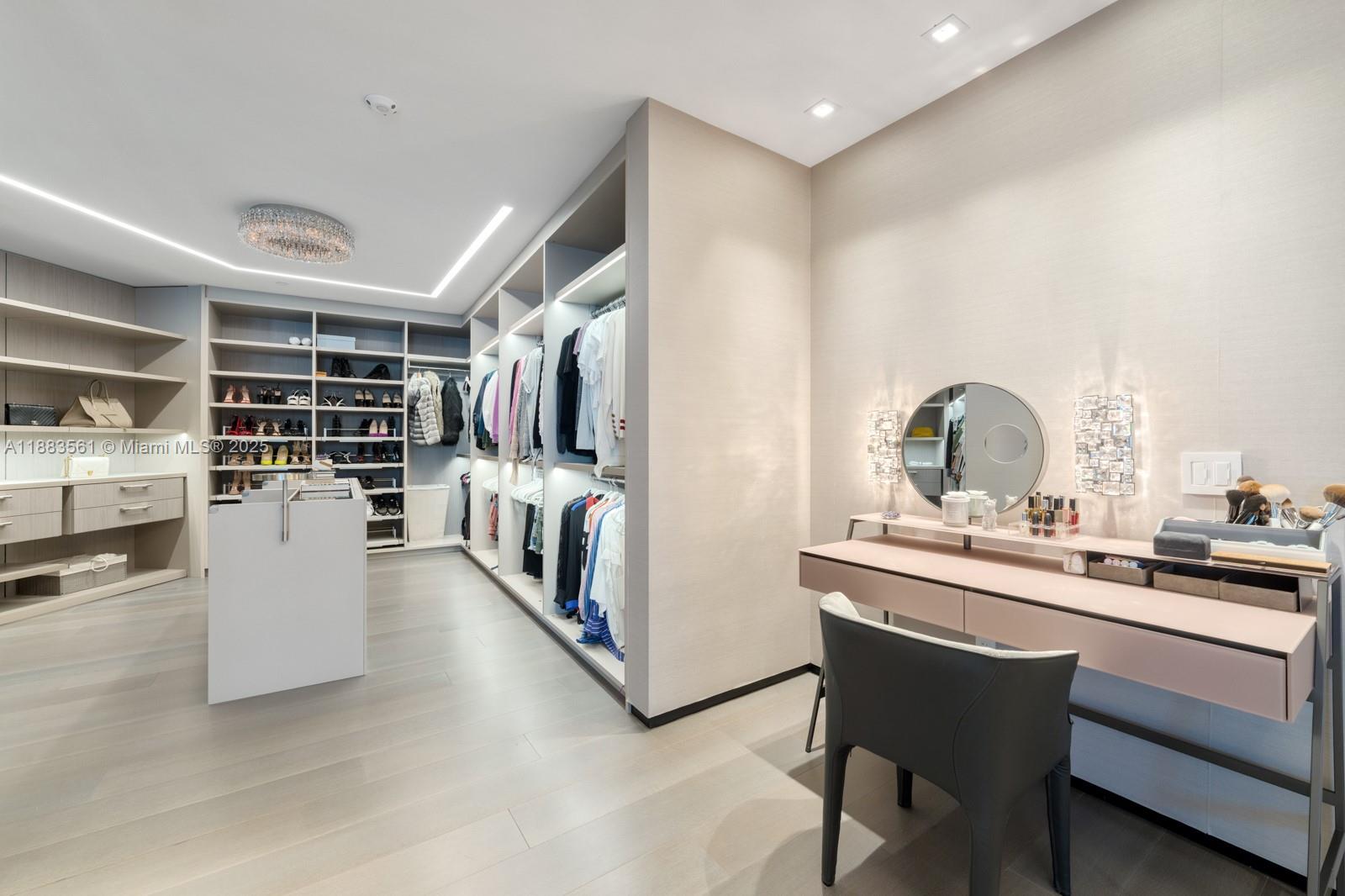 18555 Collins Avenue, Unit PH1 Sunny Isles Beach, FL 33160 - Photo 15 of 32 a dining hall with stainless steel appliances kitchen island granite countertop a sink and cabinets