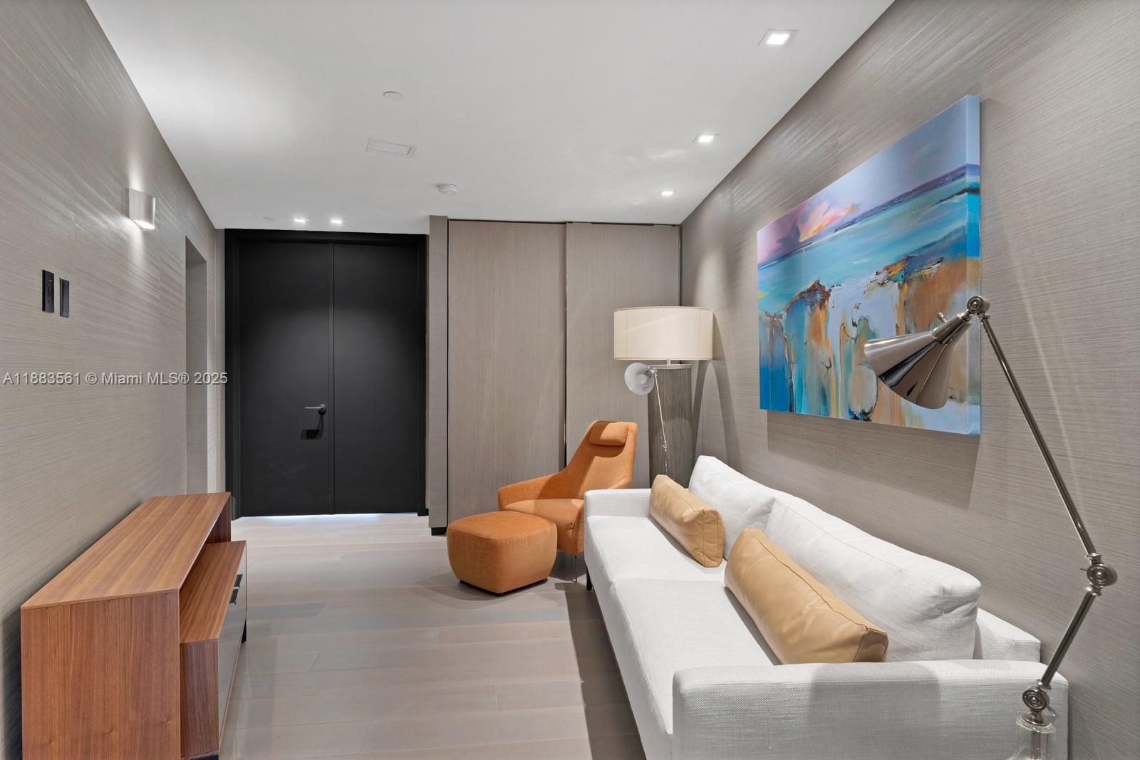 18555 Collins Avenue, Unit PH1 Sunny Isles Beach, FL 33160 - Photo 17 of 32 a bedroom with a bed and furniture