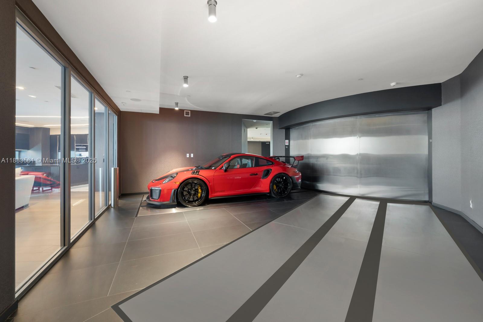 18555 Collins Avenue, Unit PH1 Sunny Isles Beach, FL 33160 - Photo 20 of 32 a car parked in parking room