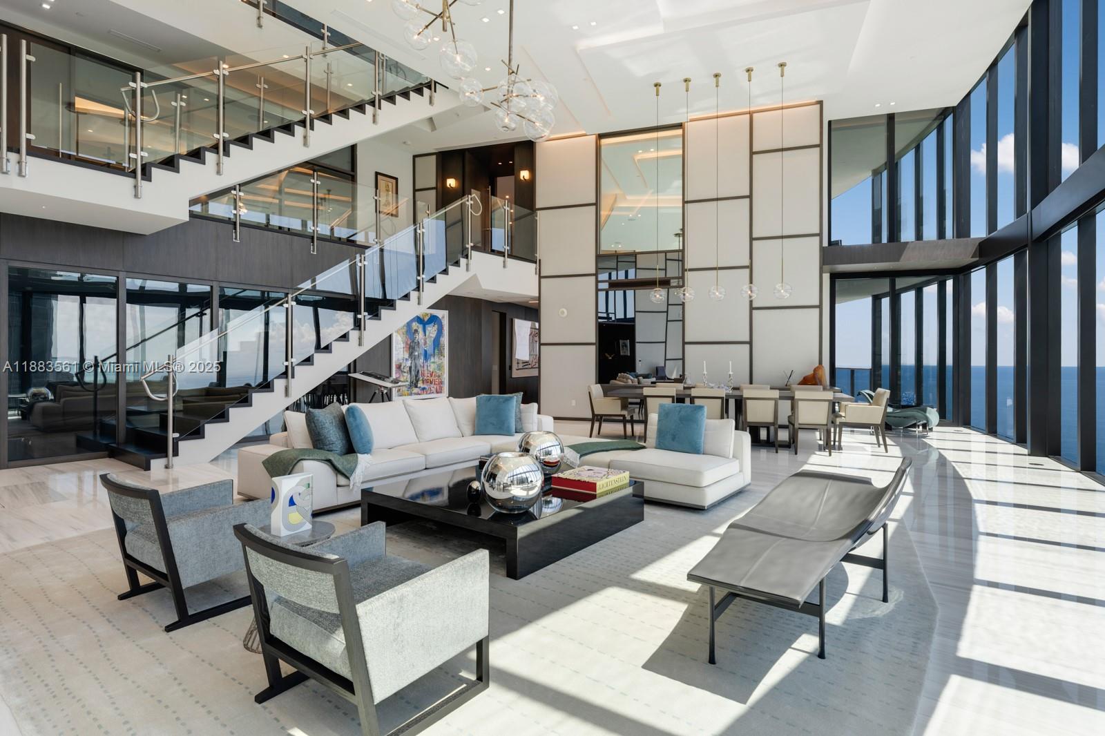 18555 Collins Avenue, Unit PH1 Sunny Isles Beach, FL 33160 - Photo 2 of 32 a living room with furniture