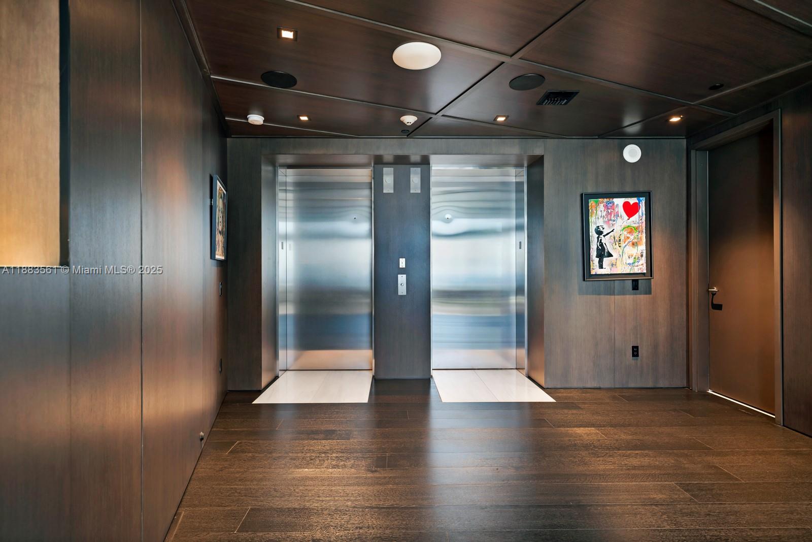 18555 Collins Avenue, Unit PH1 Sunny Isles Beach, FL 33160 - Photo 21 of 32 a view of water heater room with wooden floor