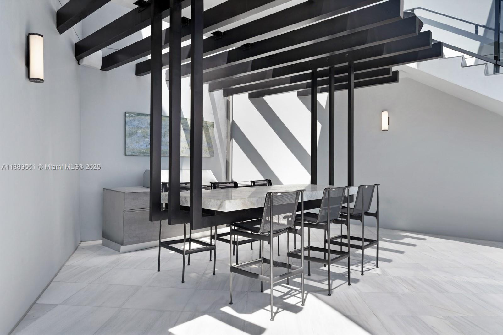 18555 Collins Avenue, Unit PH1 Sunny Isles Beach, FL 33160 - Photo 26 of 32 a dining room with furniture and window