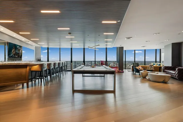 a kitchen with lots of counter top space and living room