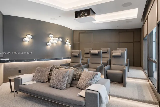 a living room with furniture and a ceiling fan