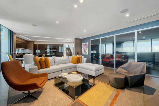 a living room with furniture and a table