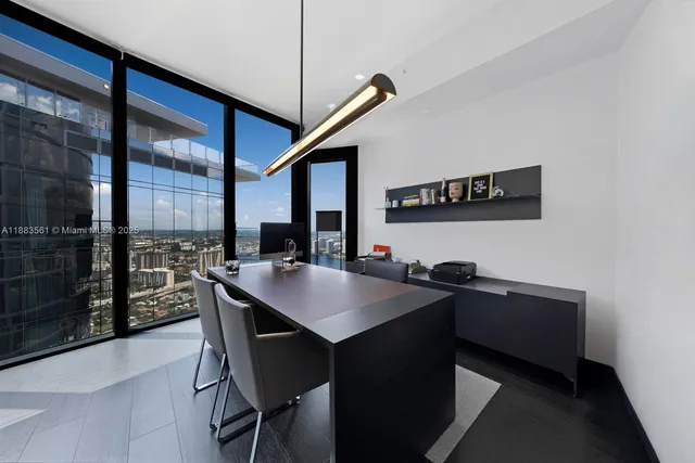 a kitchen with a table and chairs
