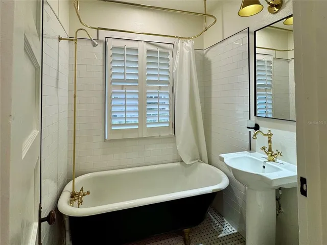 a bathroom with a sink and a bathtub