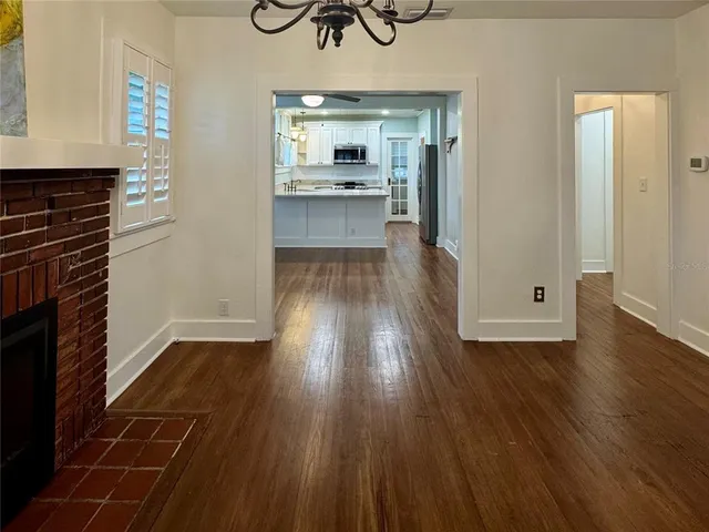 a view of a kitchen cabinets and wooden floor