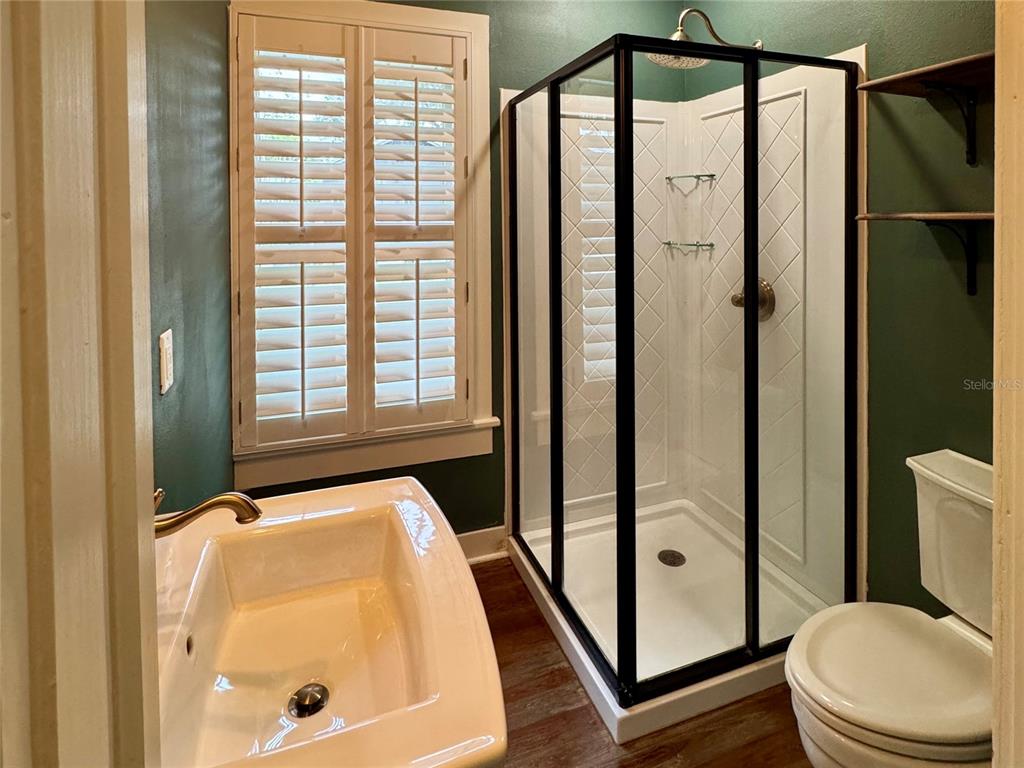 707 Southeast 10th Place Ocala, FL 34471 - Photo 9 of 12 a bathroom with a toilet and a shower