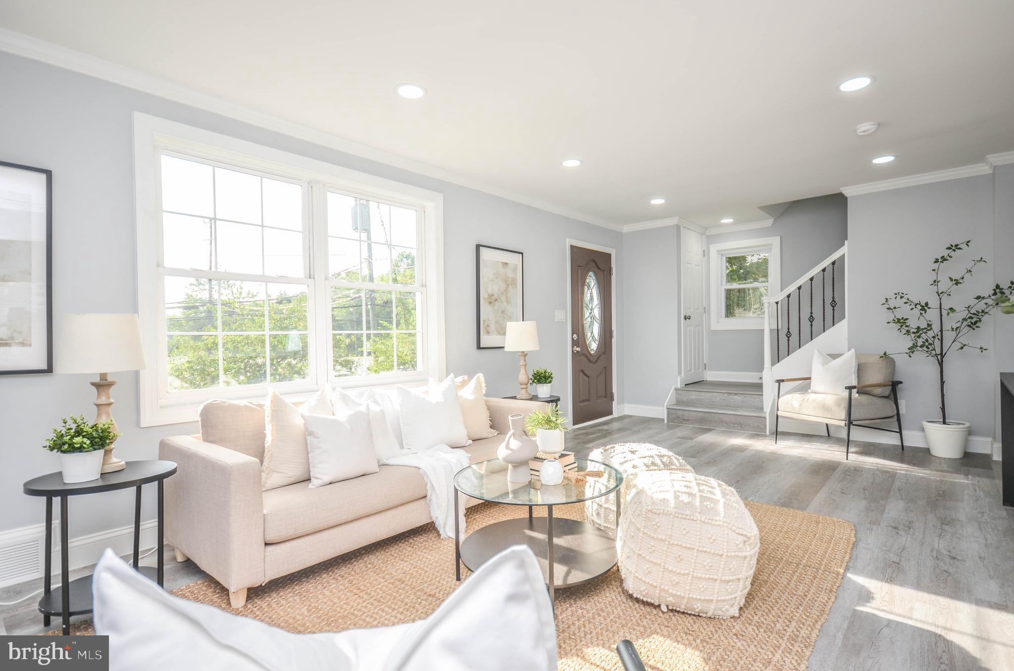 7009 Adelphi Road Hyattsville, MD 20782 - Photo 1 of 41 a living room with furniture and a large window