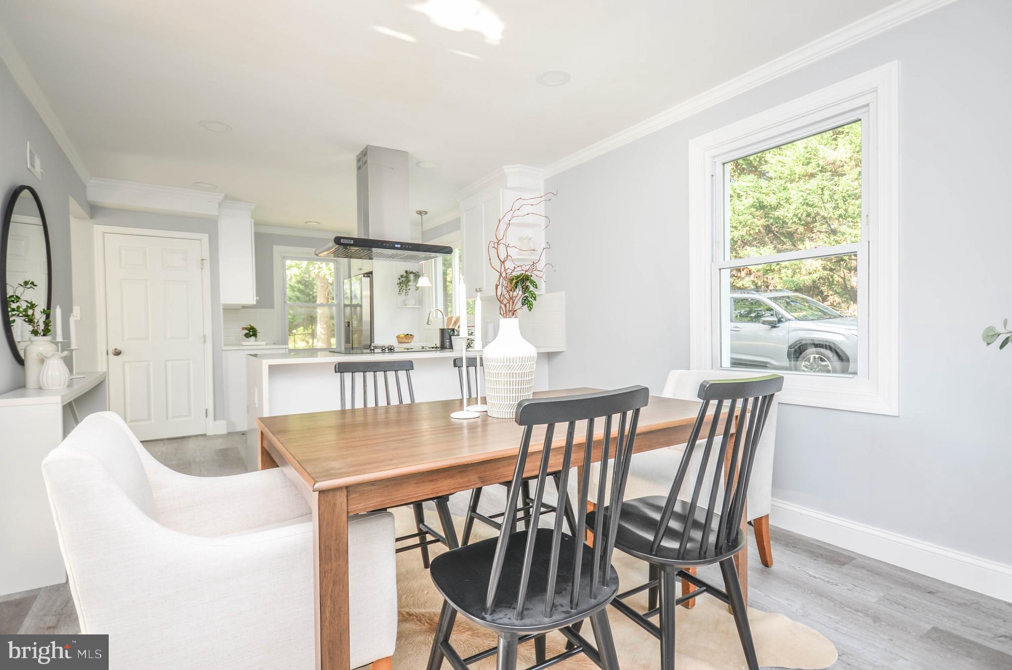 7009 Adelphi Road Hyattsville, MD 20782 - Photo 13 of 41 a view of a dining room with furniture window and outside view