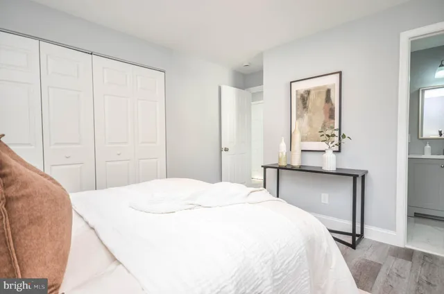 a bedroom with a bed and a table