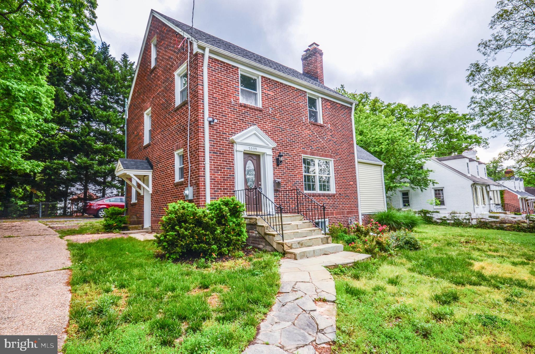 7009 Adelphi Road Hyattsville, MD 20782 - Photo 4 of 41 a front view of a house with garden