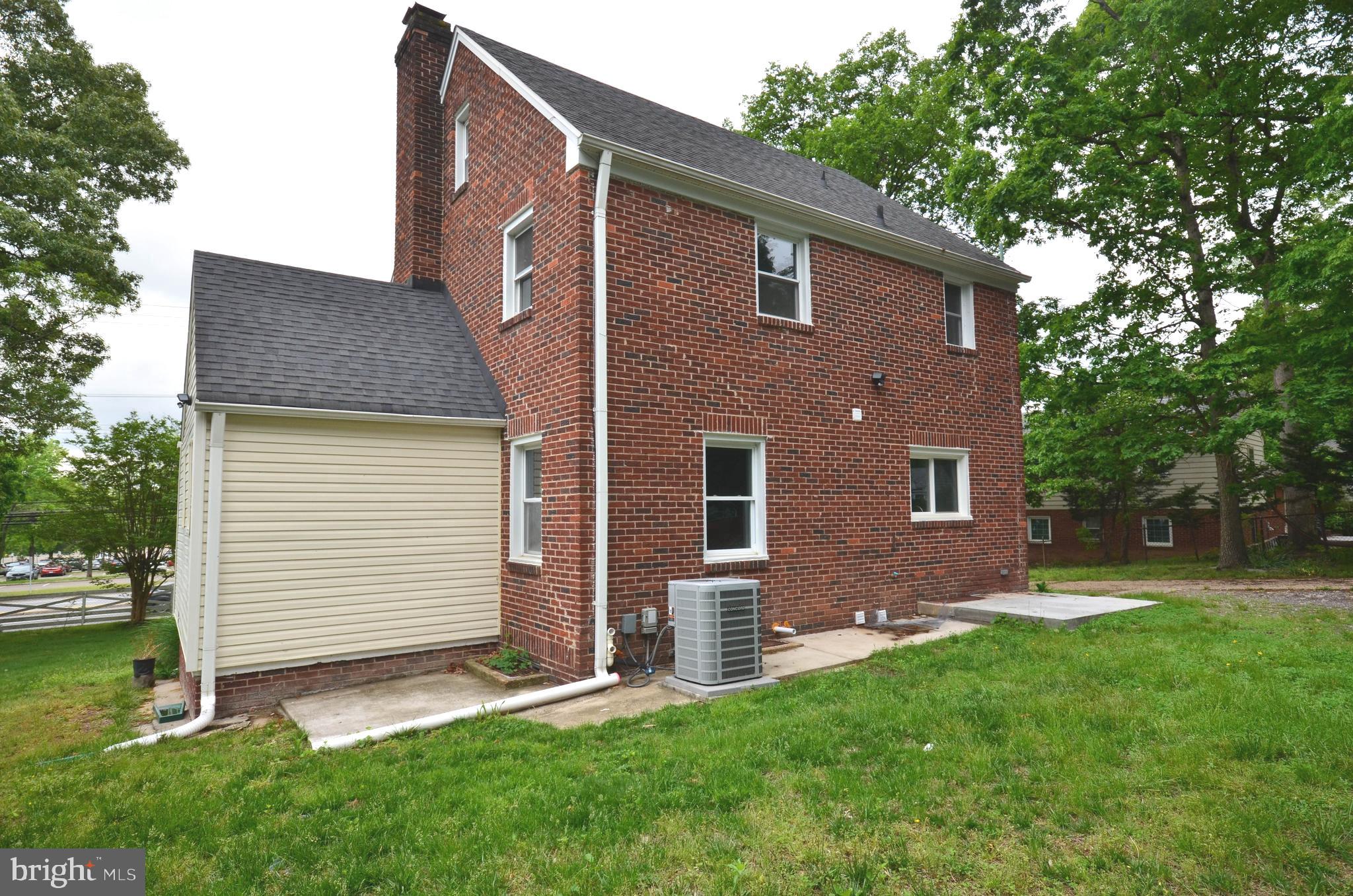 7009 Adelphi Road Hyattsville, MD 20782 - Photo 41 of 41 a backyard of a house with lots of green space
