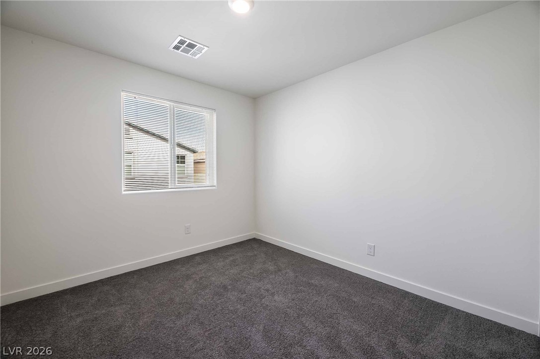 12749 Epperly Street Henderson, NV 89044 - Photo 16 of 22 A well-lit room offering a neutral canvas for personalization, complete with a window overlooking the neighborhood.
