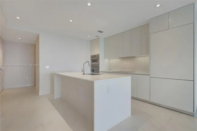 a view of a patio with table and chairs and potted plants