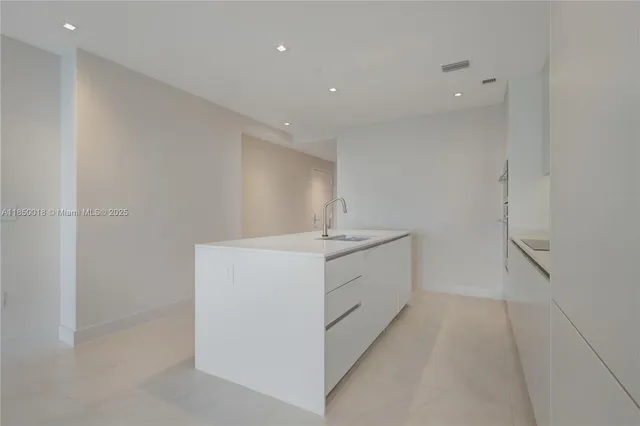 a view of a house with potted plants