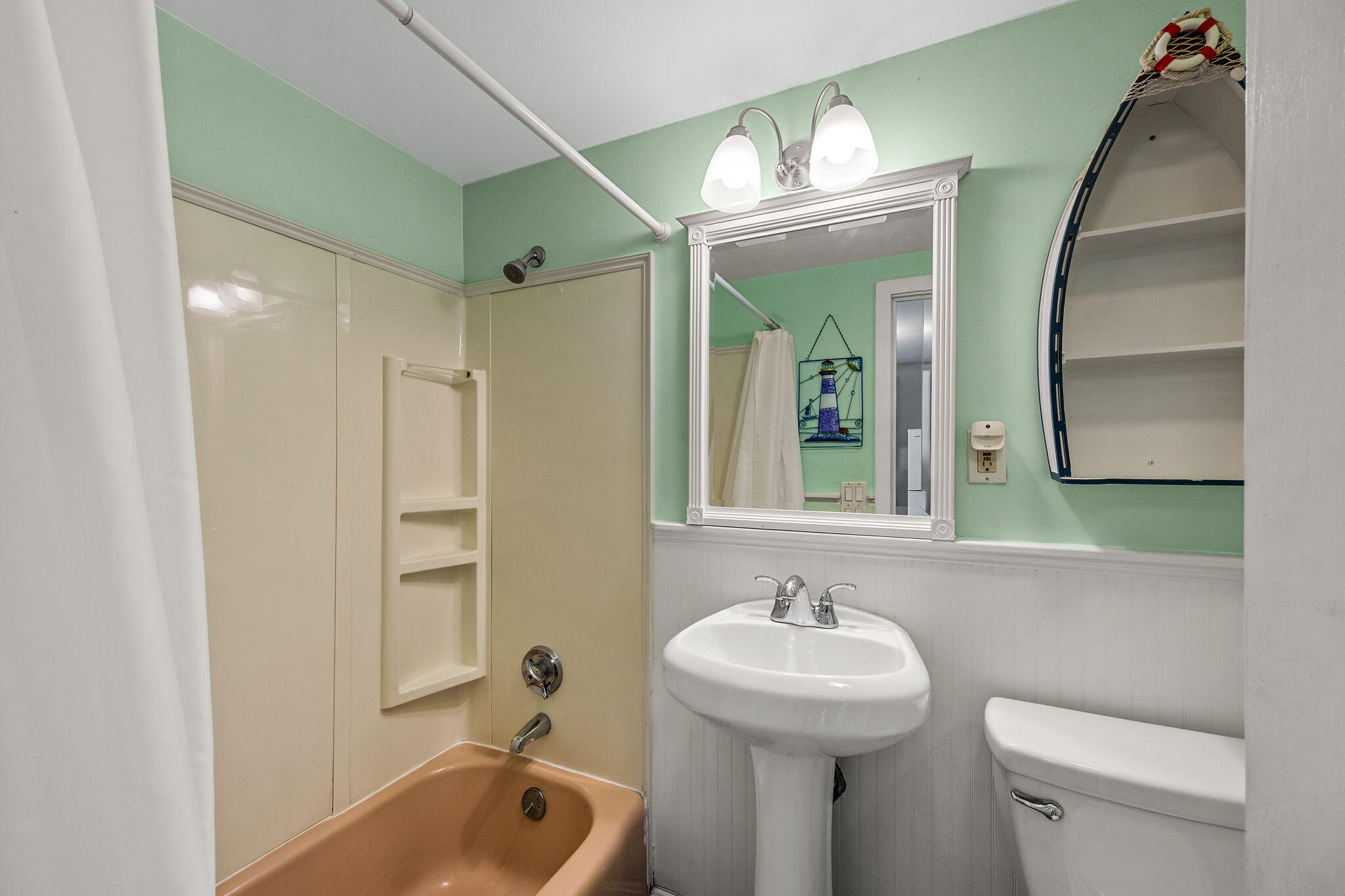 132 Shore Road, Unit 13 Truro, MA 02666 - Photo 6 of 21 a bathroom with a sink a toilet and a mirror