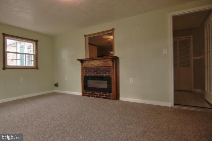 94 Arnold Road Enola, PA 17025 - Photo 25 of 29 All seasons room with an electric fireplace heater