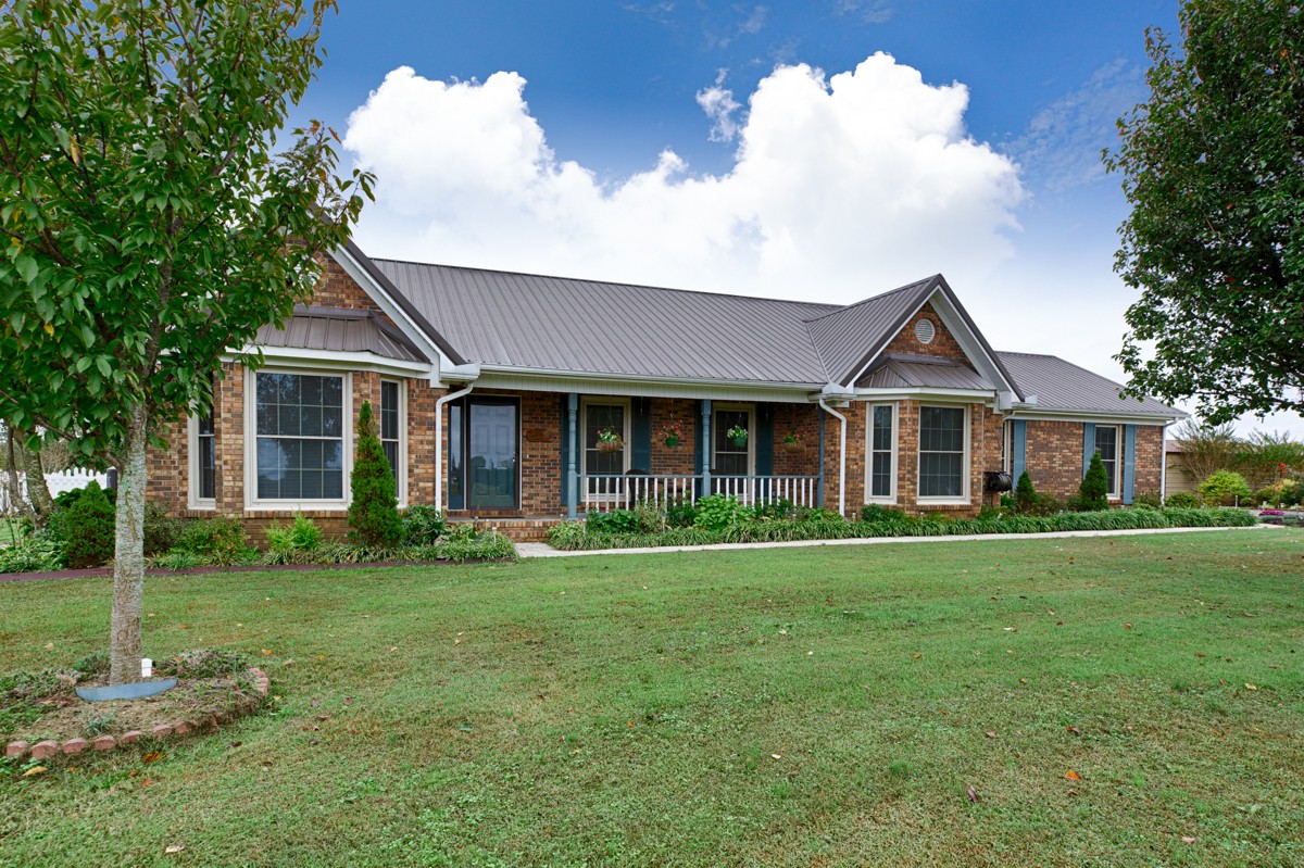 27404 Cedar Hill Road Ardmore, AL 35739 - Photo 1 of 32 a front view of a house with a yard