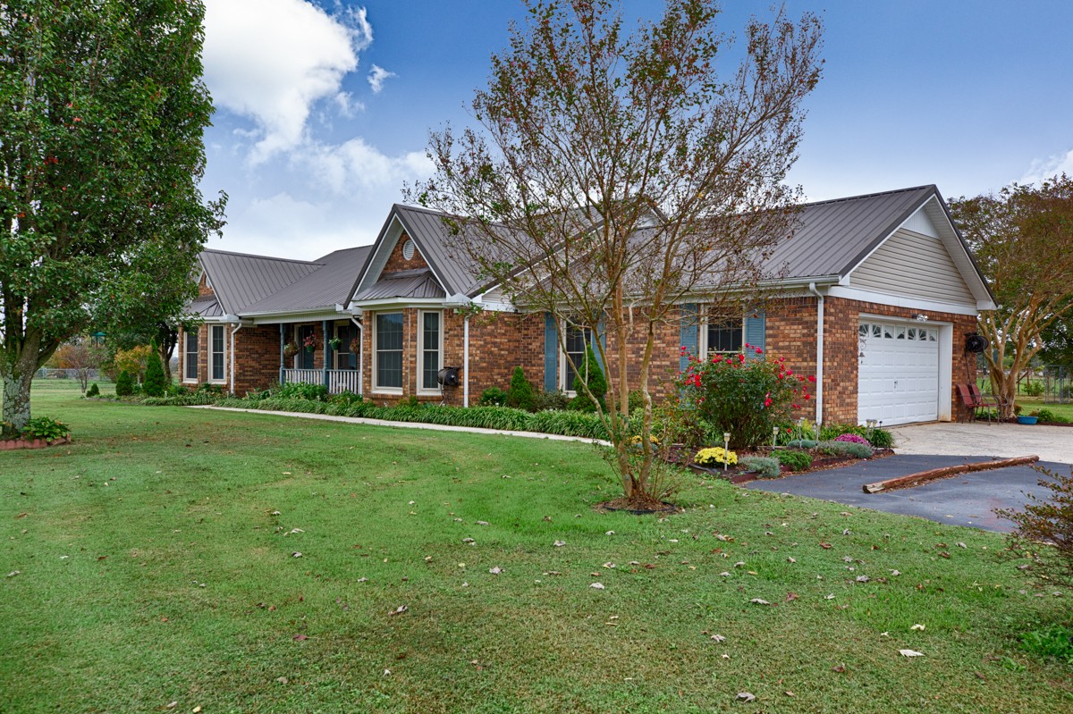 27404 Cedar Hill Road Ardmore, AL 35739 - Photo 3 of 32 a front view of a house with garden