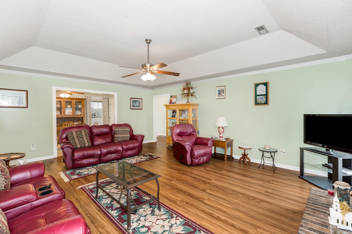 27404 Cedar Hill Road Ardmore, AL 35739 - Photo 8 of 32 a living room with furniture and a flat screen tv