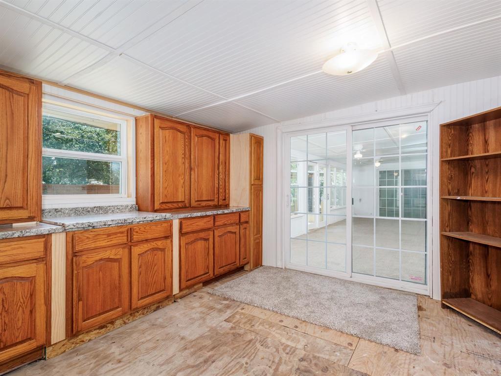 4002 Austin Avenue Brownwood, TX 76801 - Photo 27 of 34 a large kitchen with granite countertop a large window and a sink