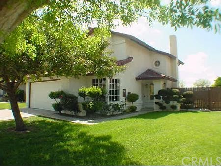 7149 Rutland Avenue Riverside, CA 92503 - Photo 1 of 1 a view of a house with backyard garden and sitting area
