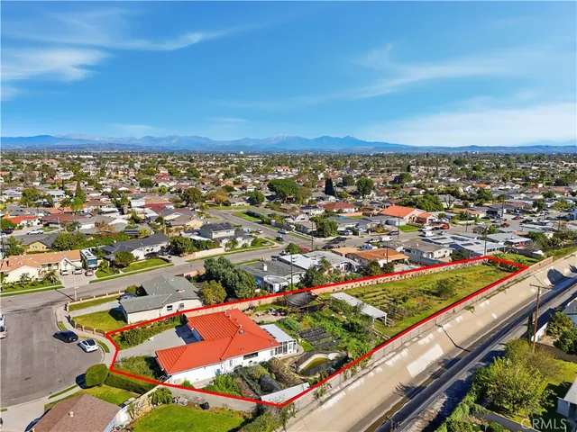 an aerial view of a building with outdoor seating