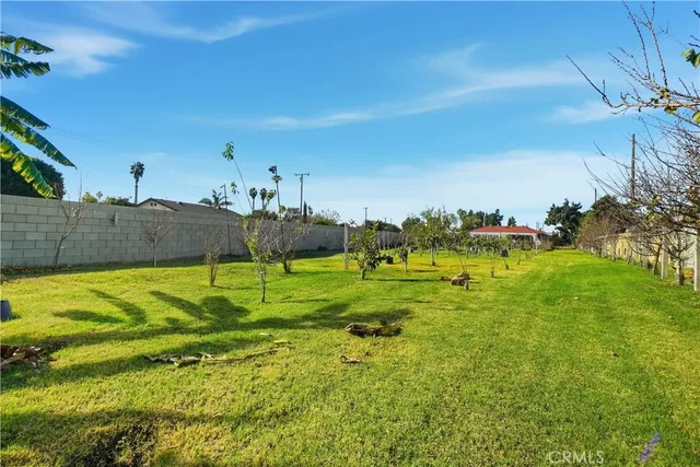 a kitchen with stainless steel appliances granite countertop a sink and a refrigerator