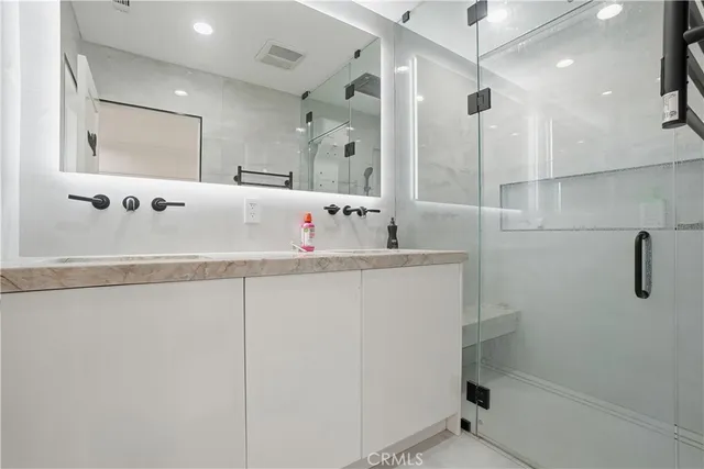 a large kitchen with a table and chairs