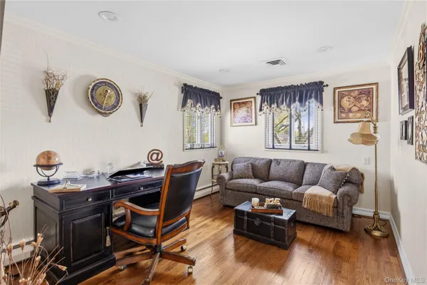 a living room with furniture and a window